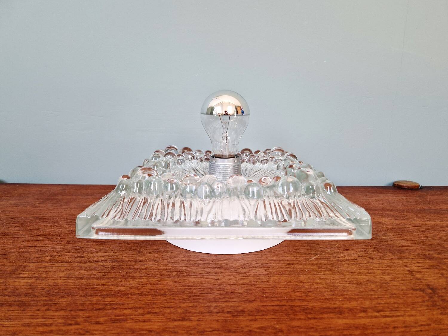 Space Age wall light in pressed transparent moulded glass, 1970.