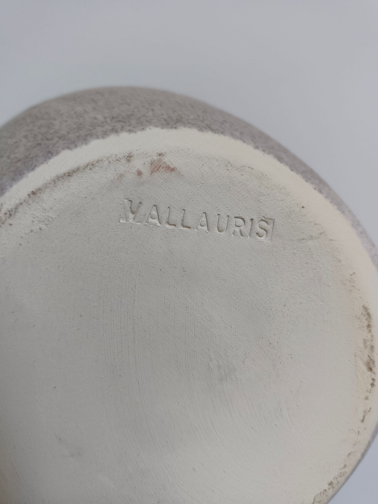 Vallauris grey candle holder with pink flowers, signed.