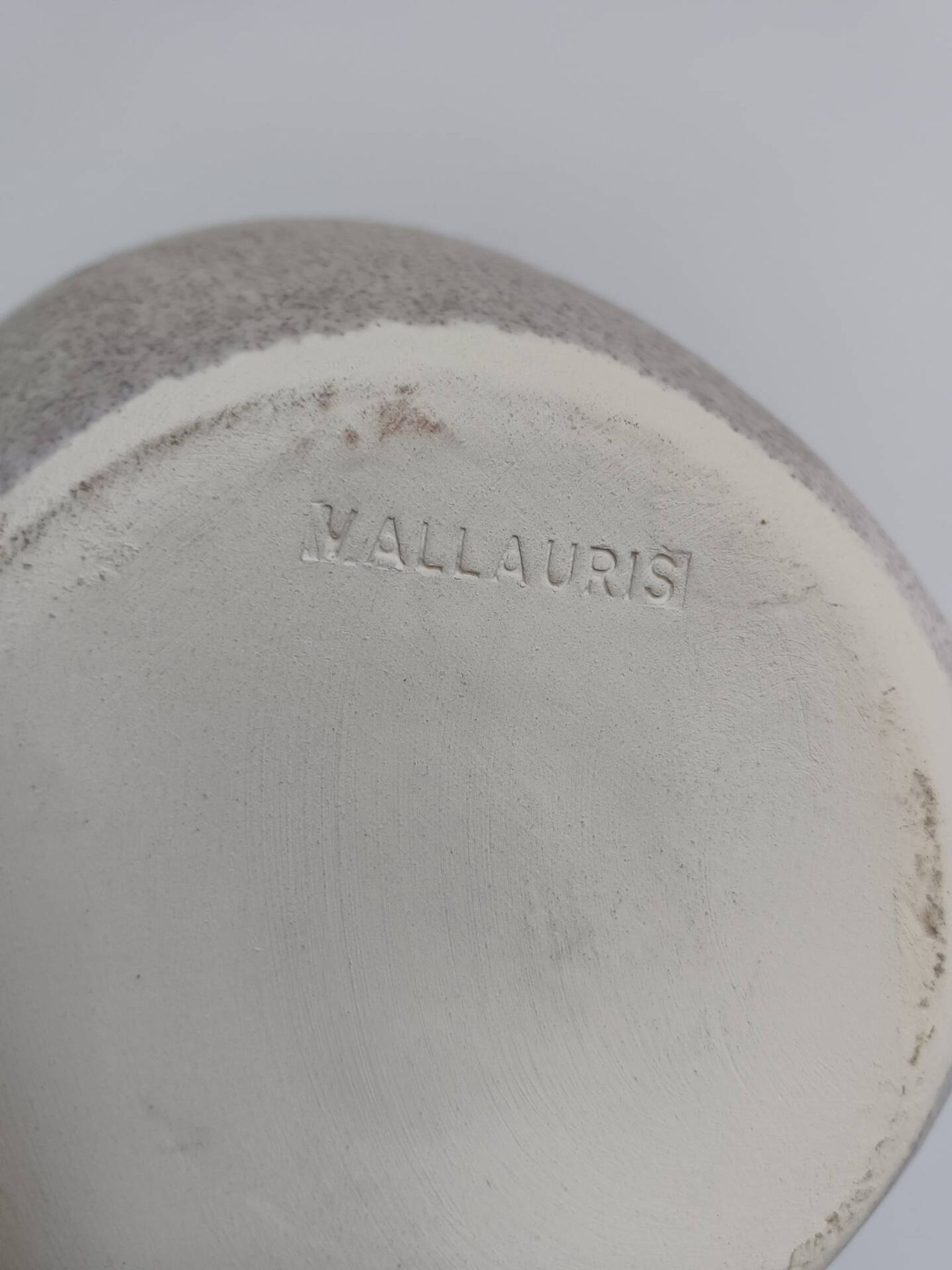 Vallauris grey candle holder with pink flowers, signed.