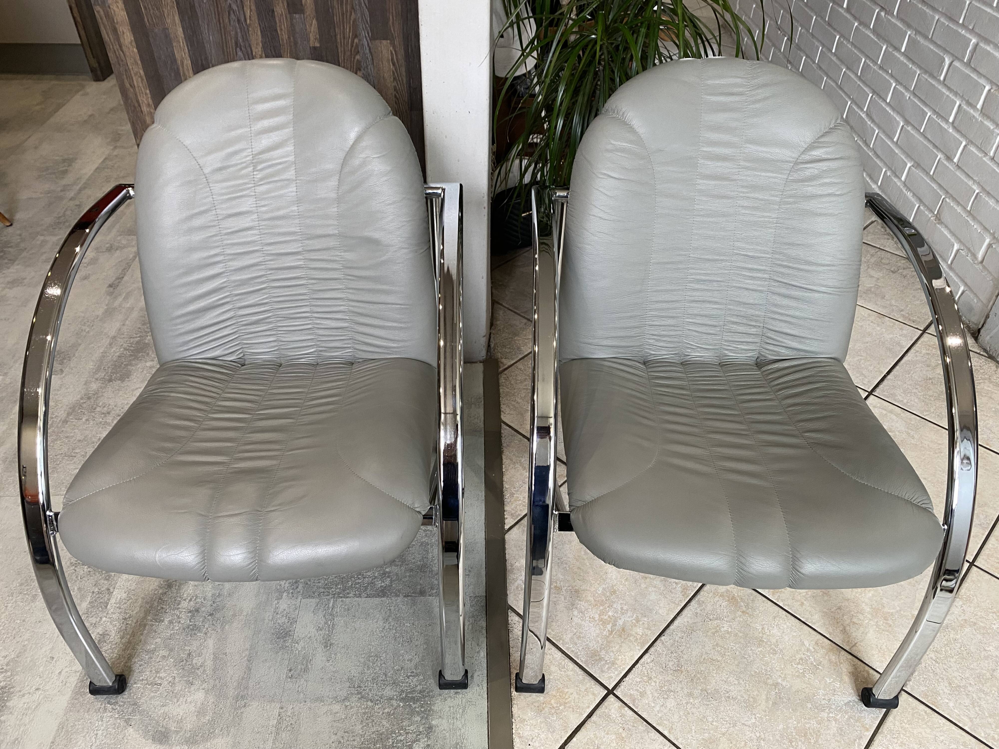Pair of Souvignet armchairs, grey leather, chrome, 1980.