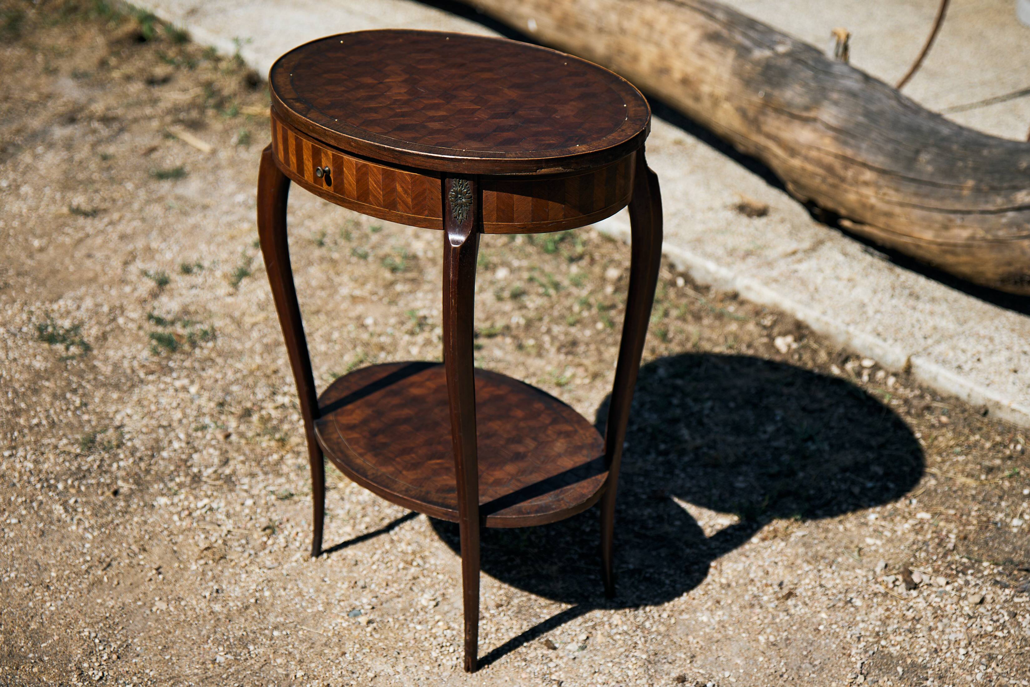 Oval coffee table in cube marquetry and bronze, Louis XV style.