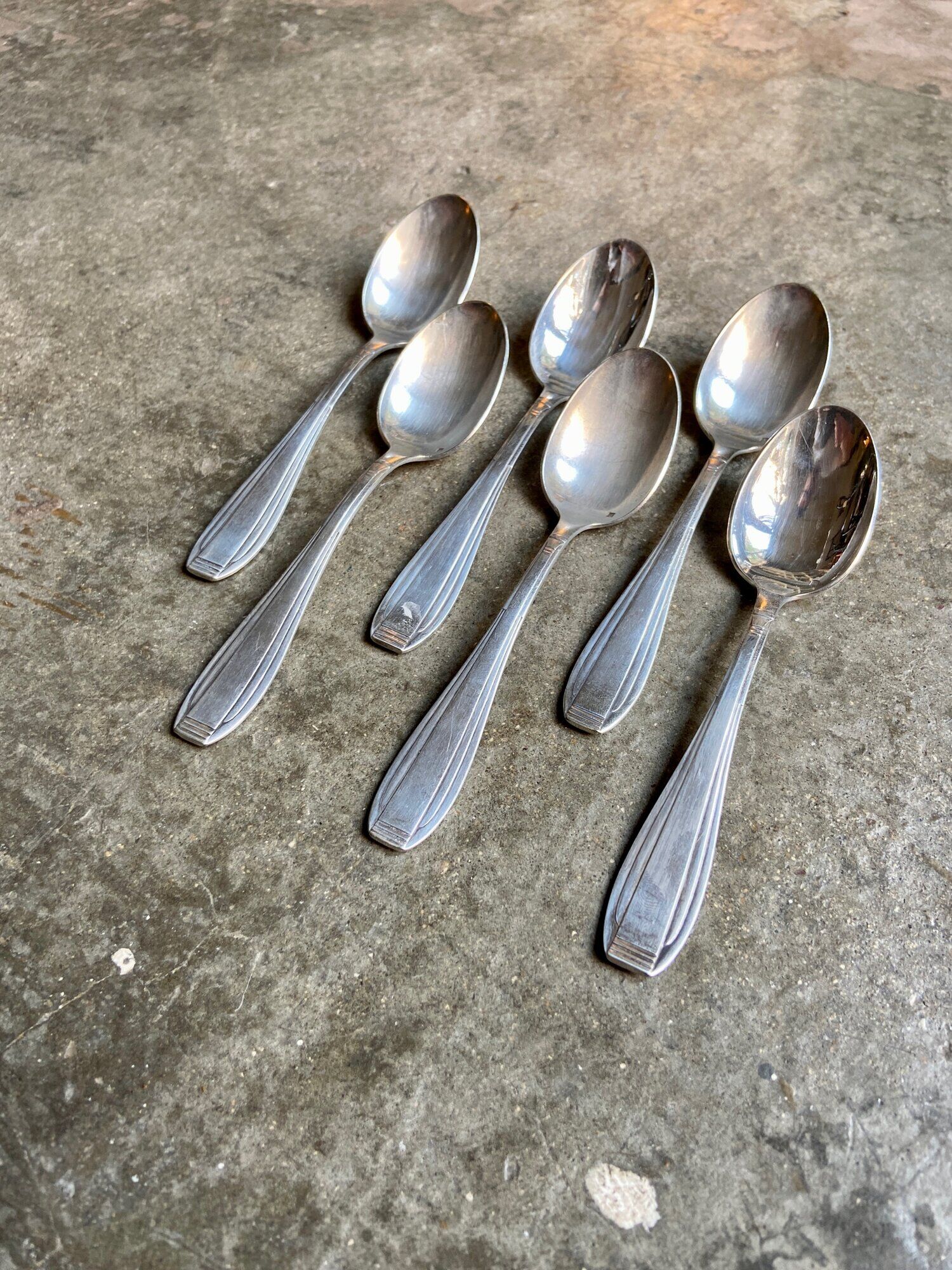 6 silver metal spoons