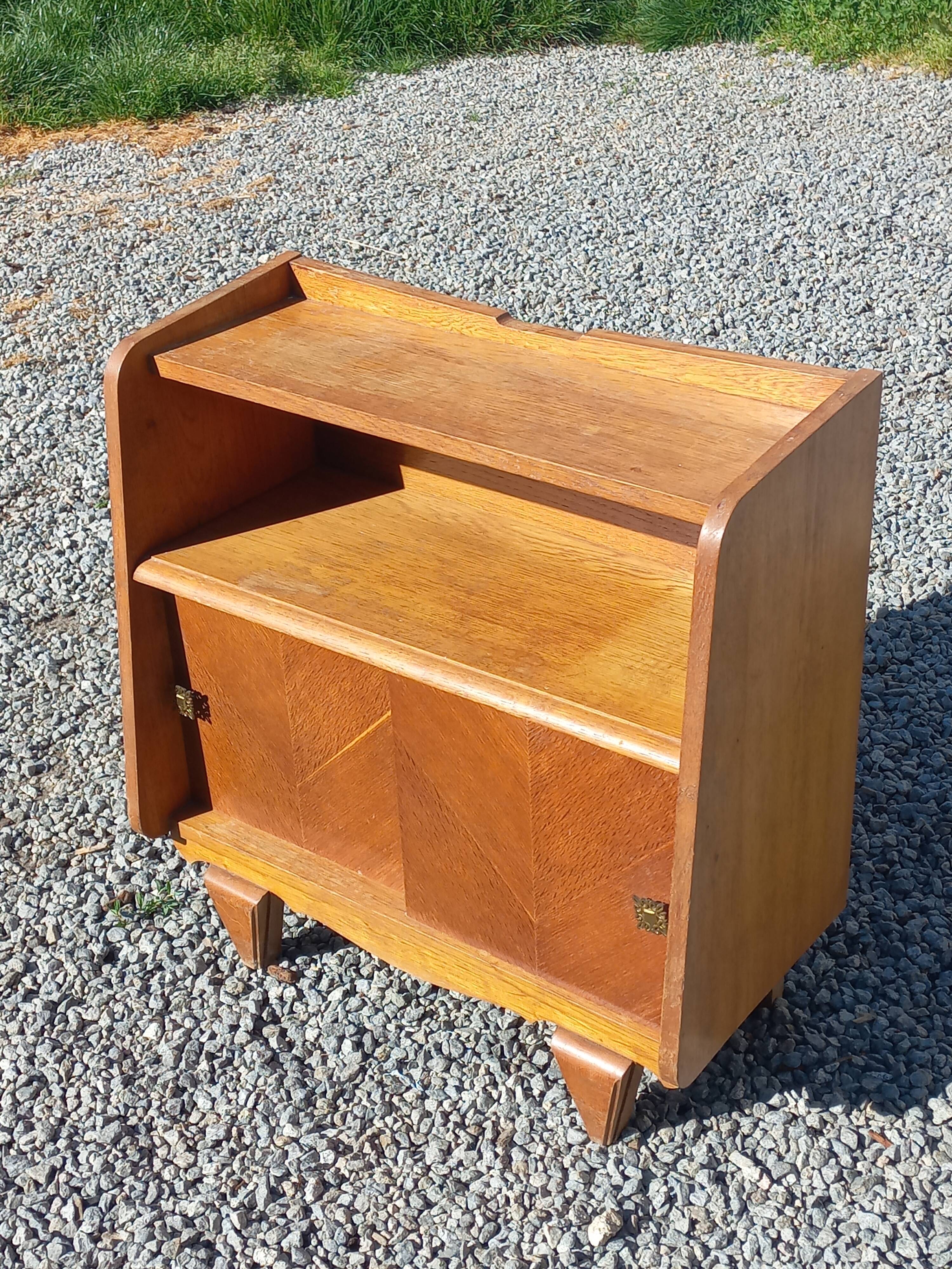 Vintage accent furniture in golden blonde oak with 2 sliding doors.