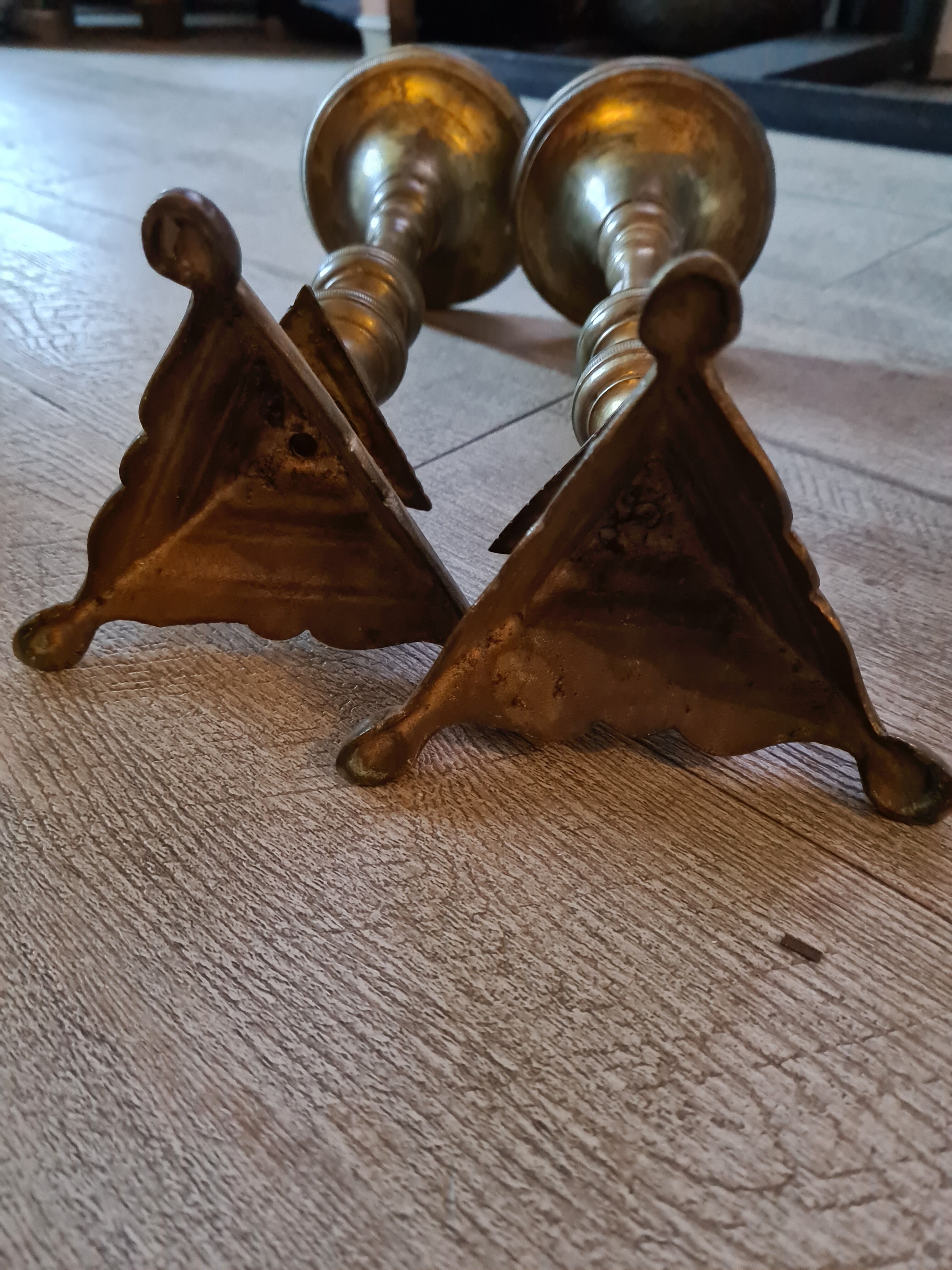 Pair of old brass candelabra