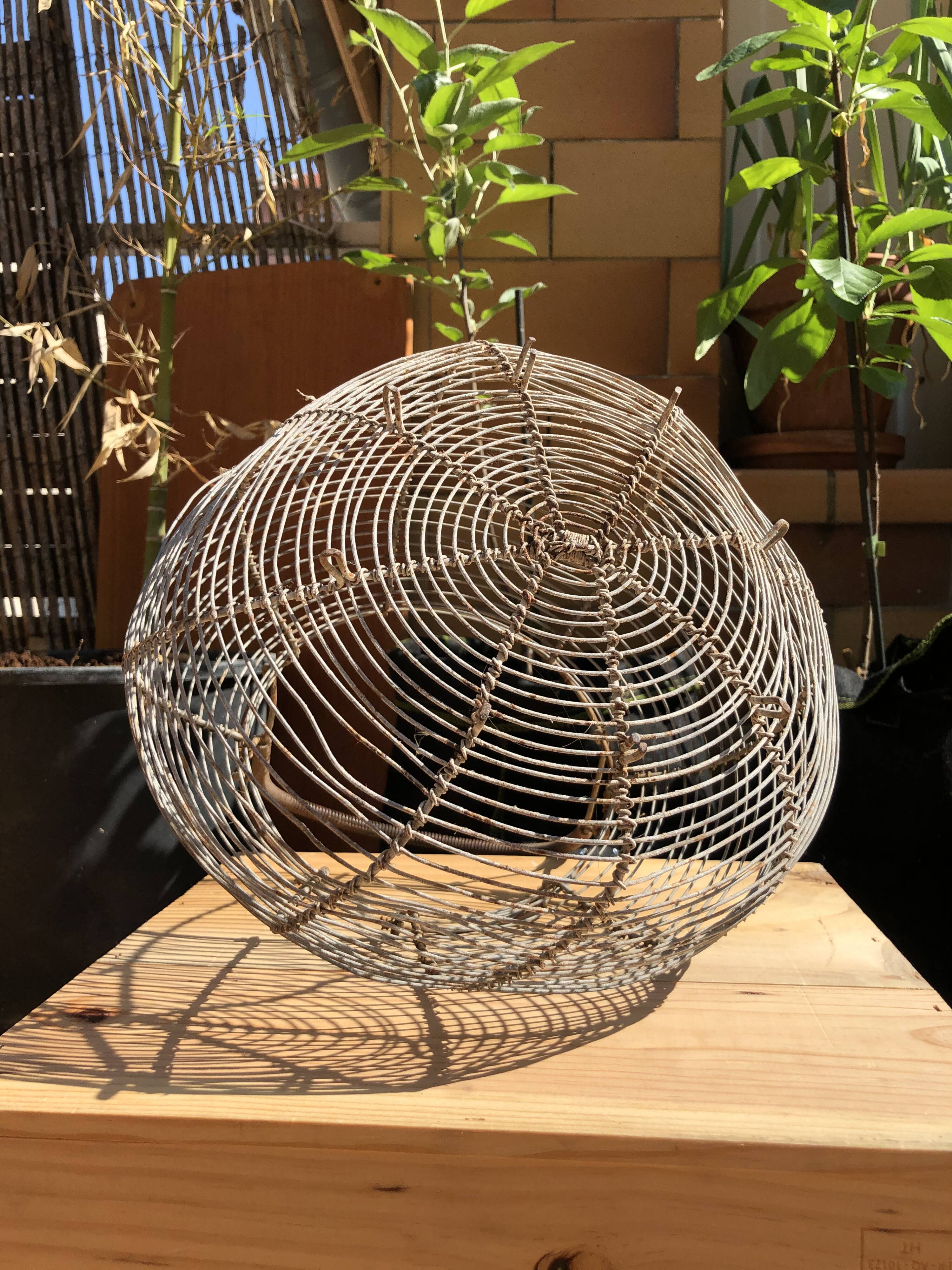 Old egg basket in metal shape round metal handle