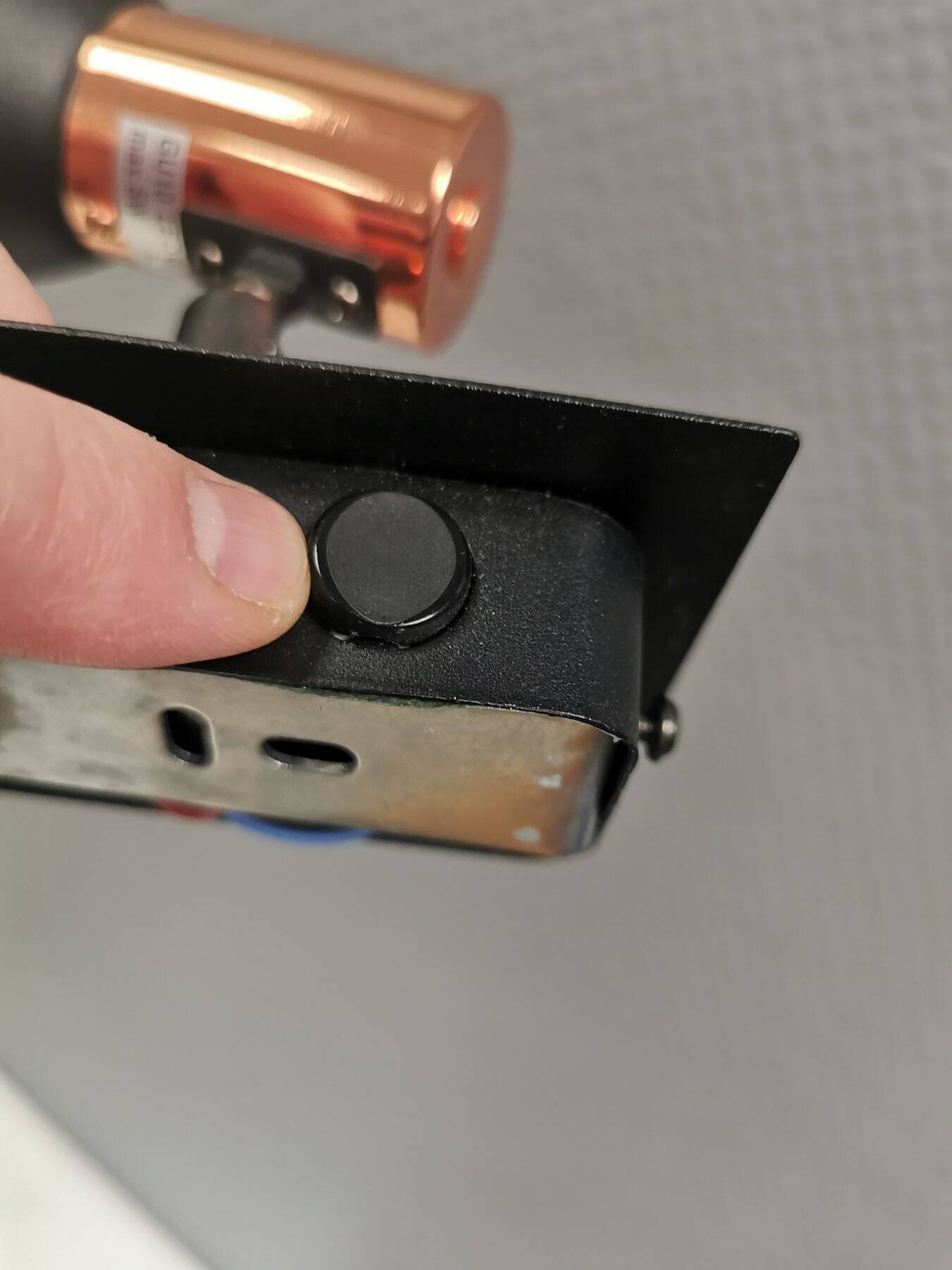 A pair of wall lamps from Eglo, in copper color and black.