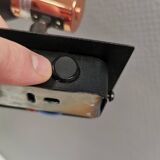 A pair of wall lamps from Eglo, in copper color and black.