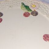 Footed dessert plate in barbotine porcelain, marked FG.