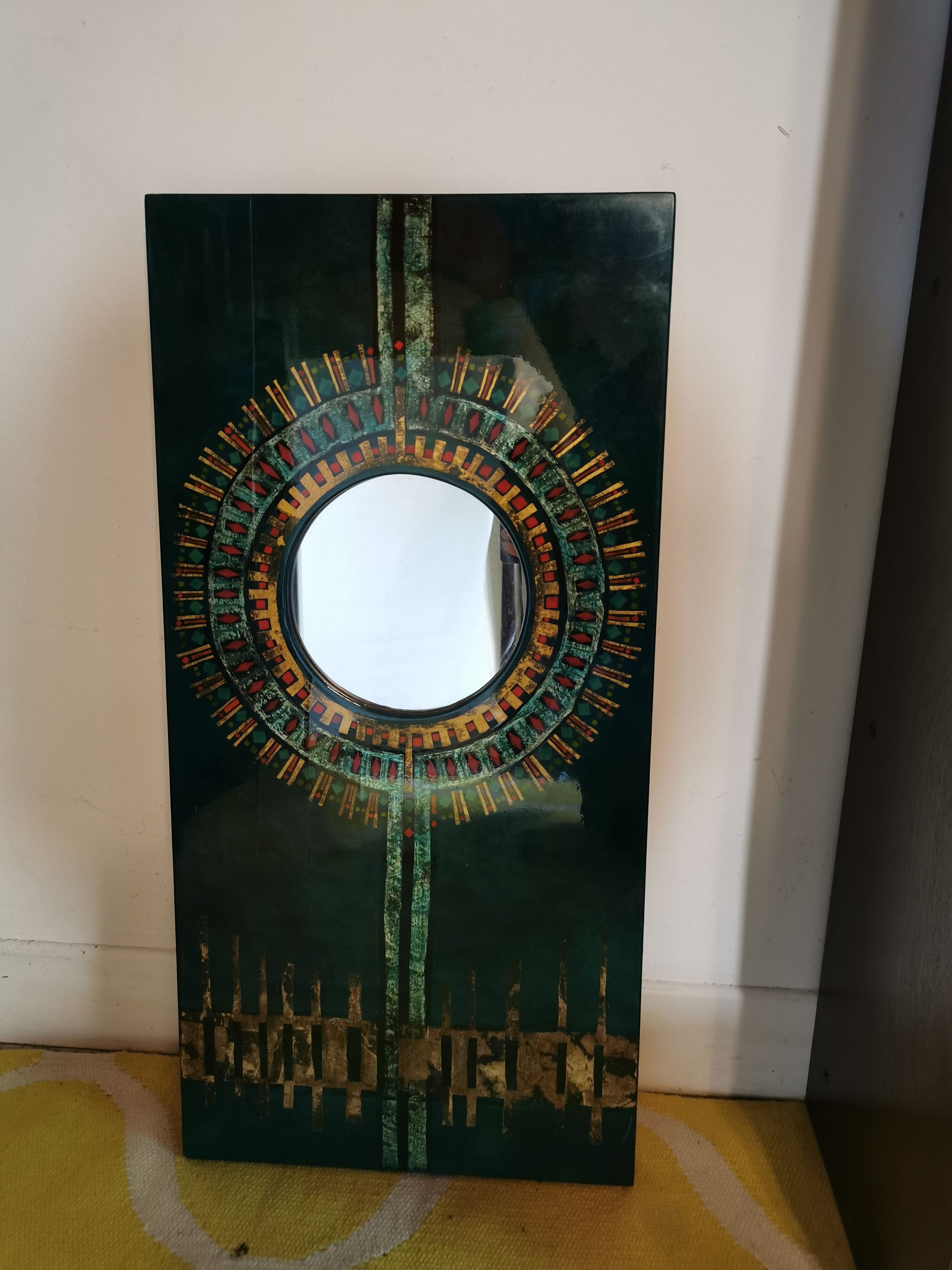 Green and gold laque mirror signed Clémence