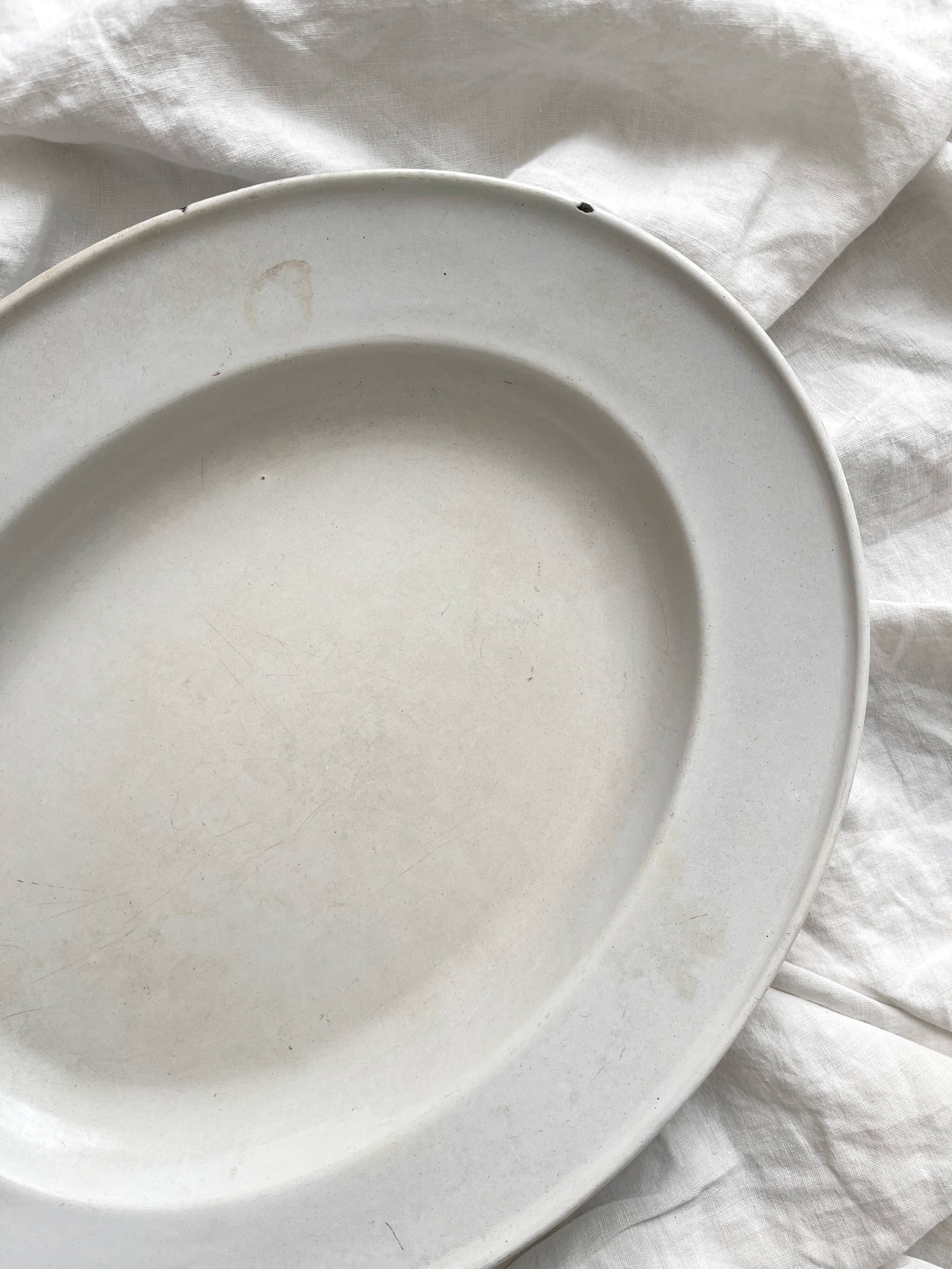 Vintage marbled white and blue enameled sheet metal oval dish