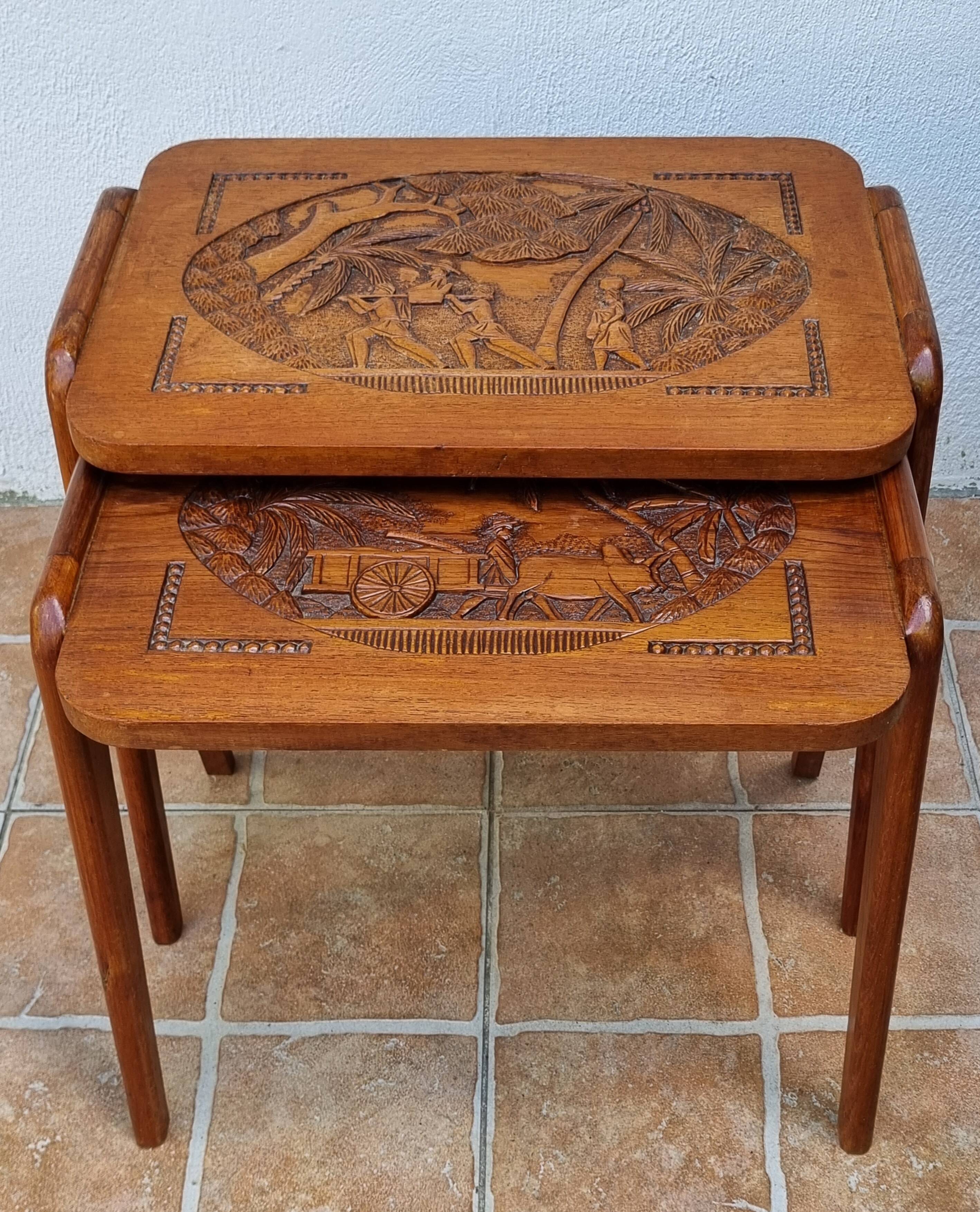 Pair of Malagasy nesting tables in carved wood, signed, m.o.f, 1955