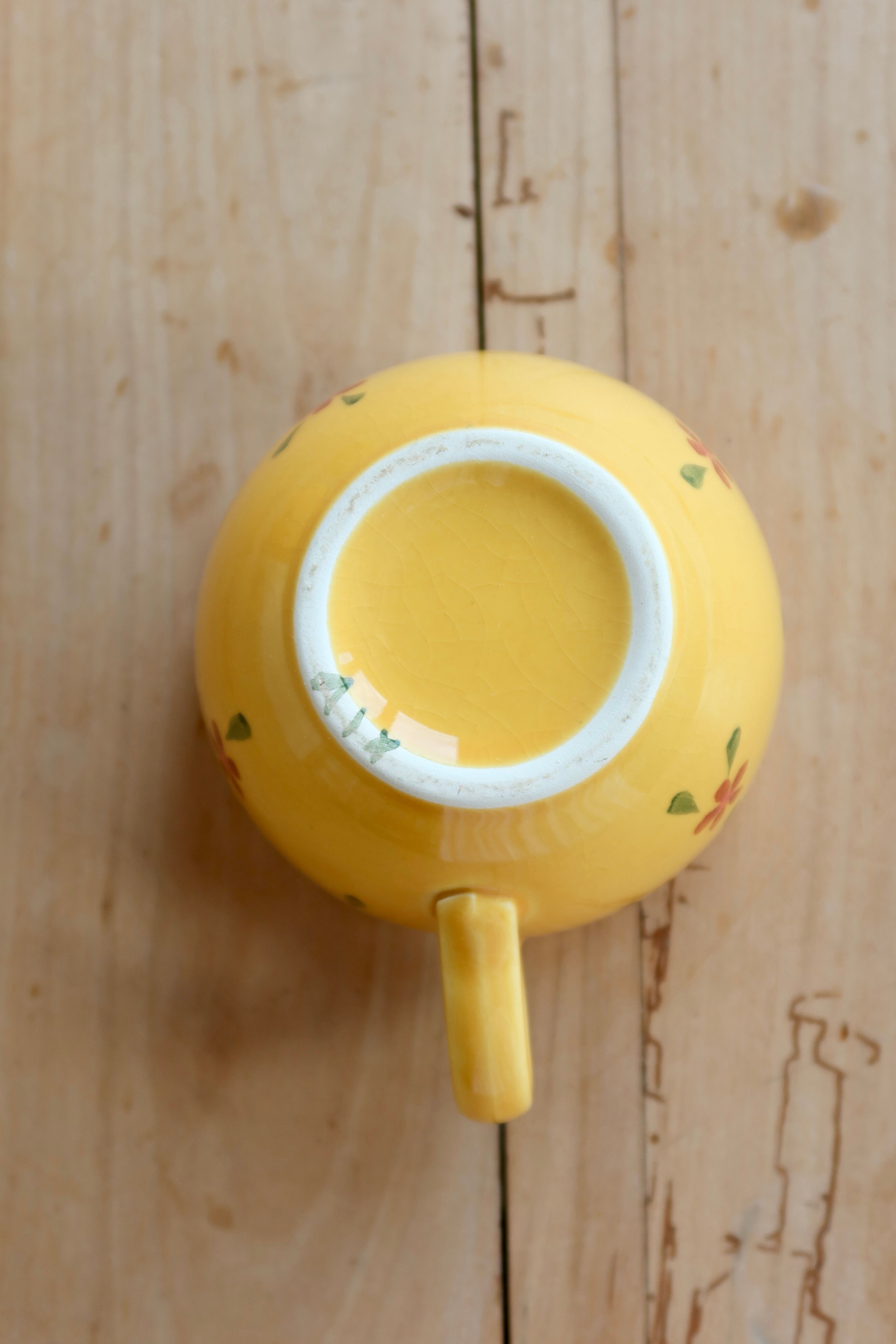 Large vintage ceramic mug in yellow with hand-painted flowers.