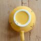 Large vintage ceramic mug in yellow with hand-painted flowers.