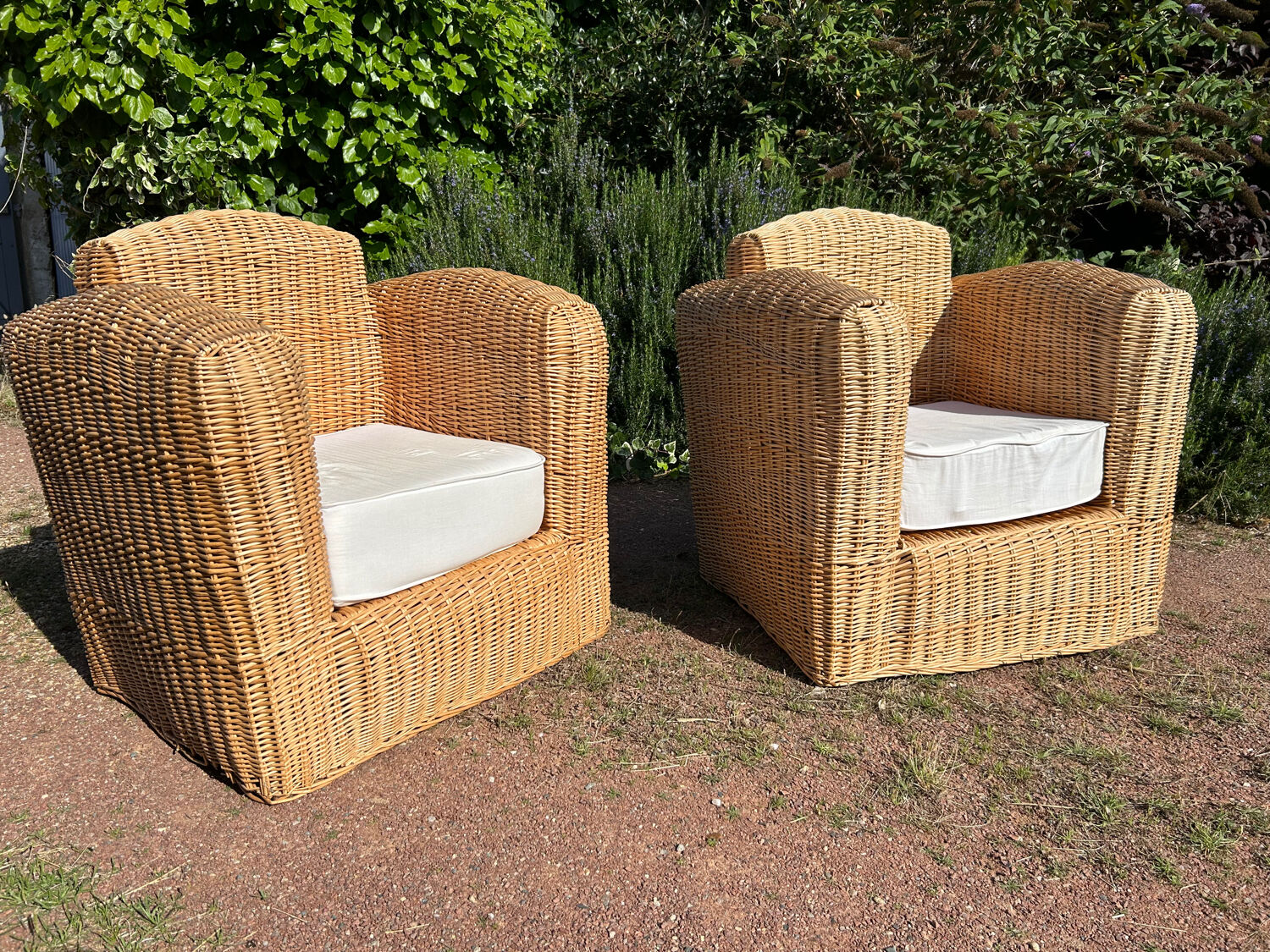 Large rattan armchairs