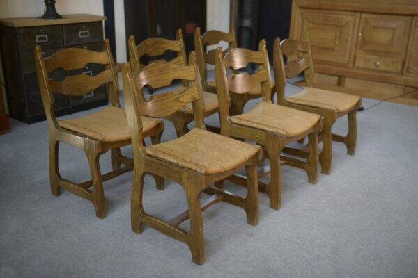 Set of 6 oak dining chairs with rush seat and 'Echelle' backrest in the style of Guillerme et Chambron 1950s