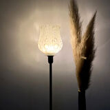 Table lamp with a white tulip lampshade and a gold base