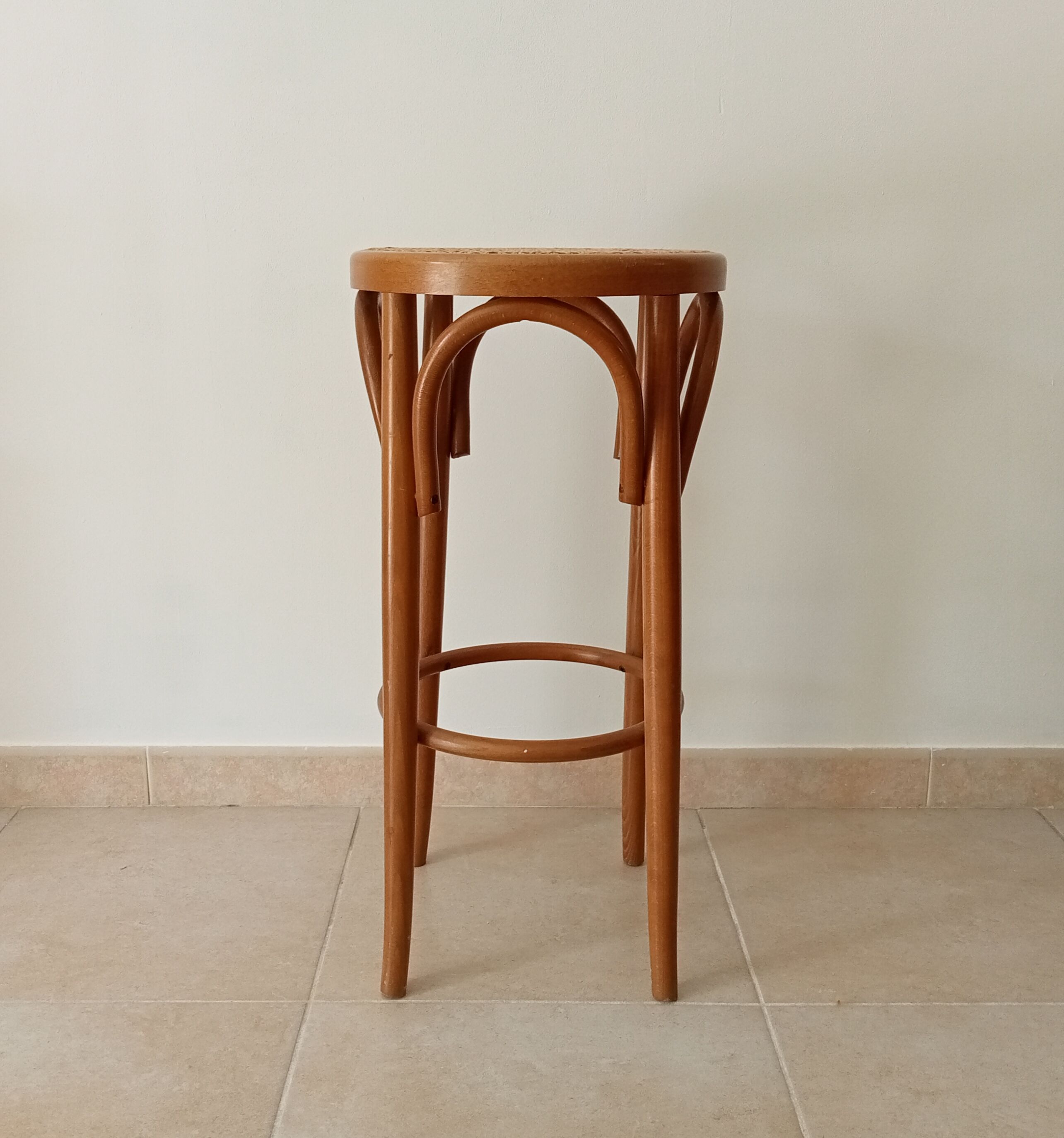 Vintage curved wooden high stool and tanned seat