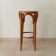 Vintage curved wooden high stool and tanned seat