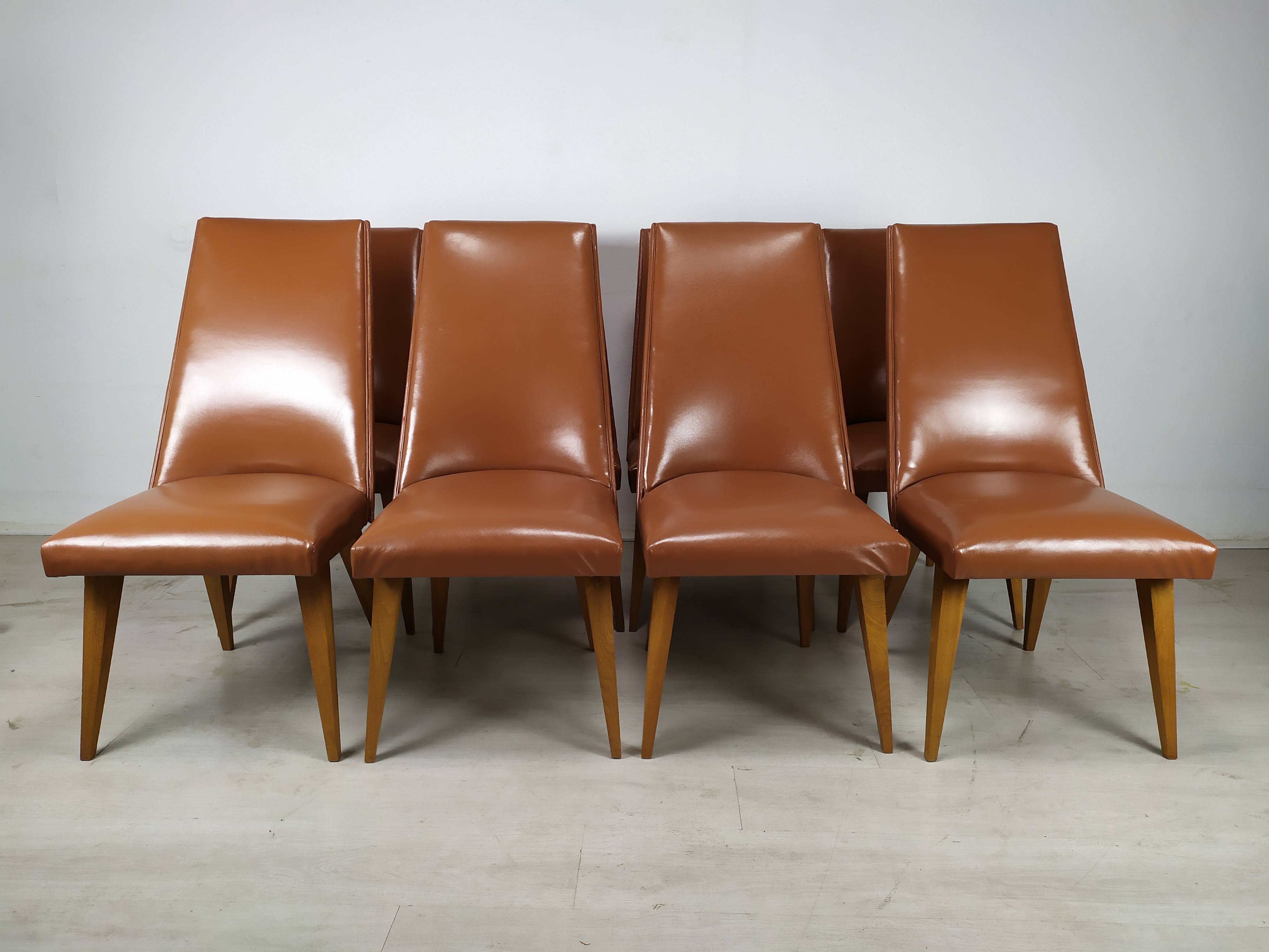 8 brown skai chairs 1950