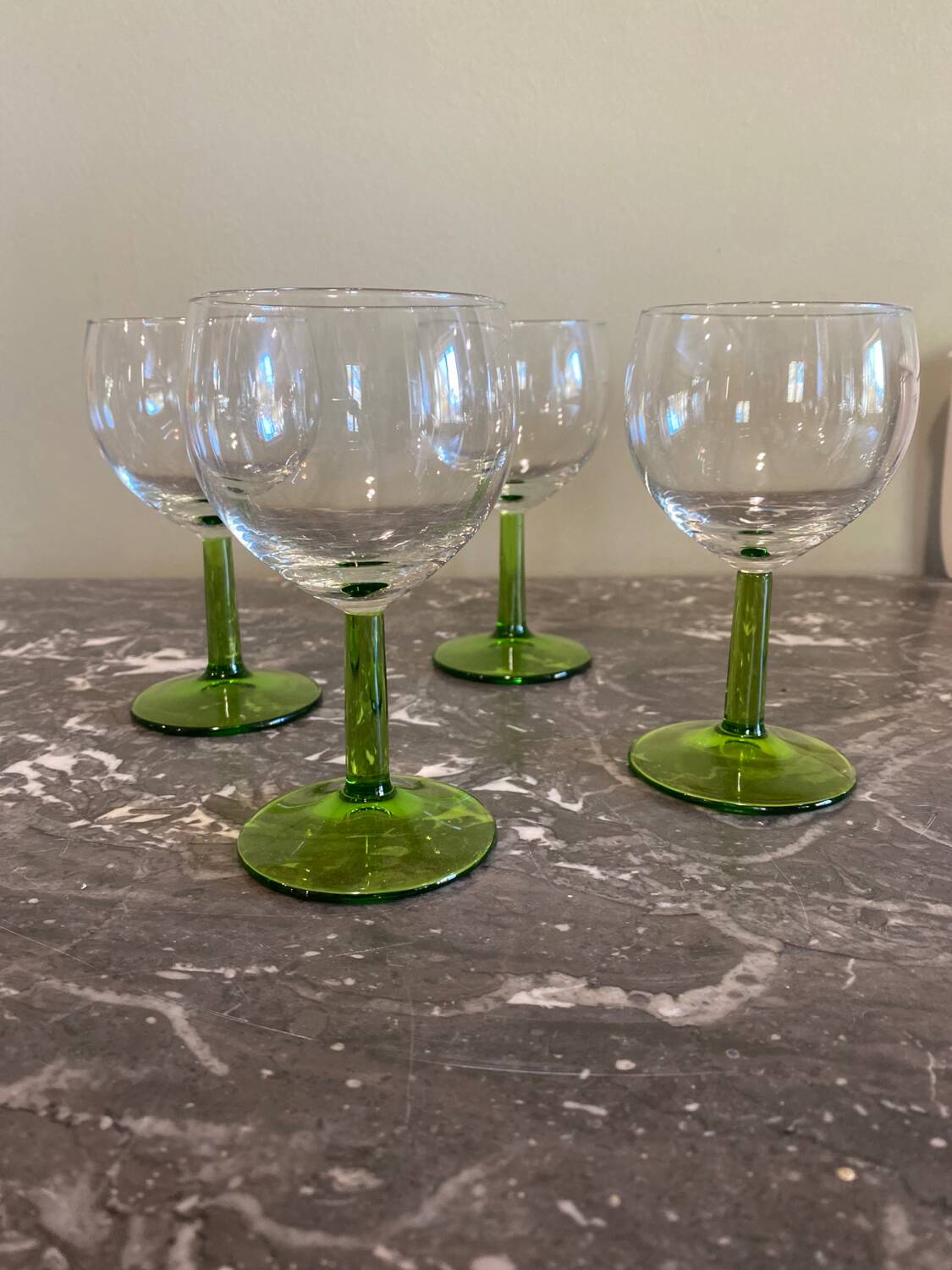 4 green stemmed glasses