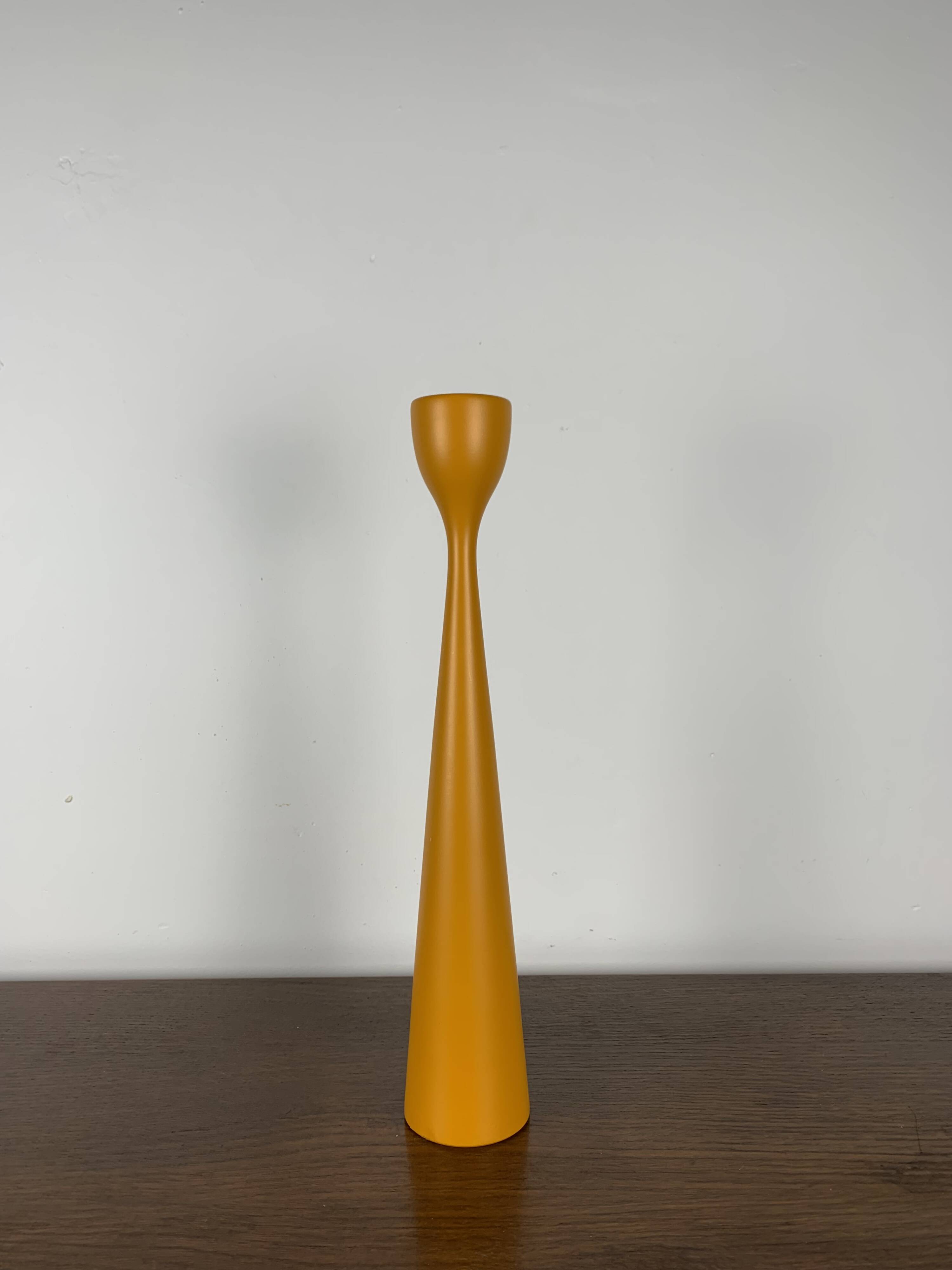 Large candle holder in orange-yellow lacquered wood