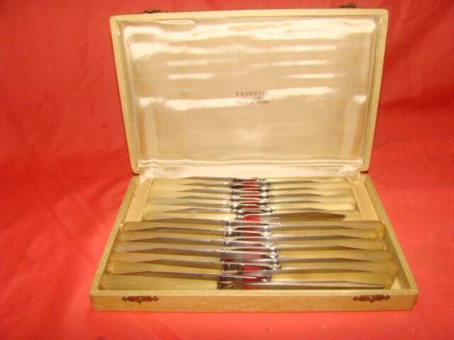Set of 12 table knives and 12 cheese knives in bone and stainless steel.