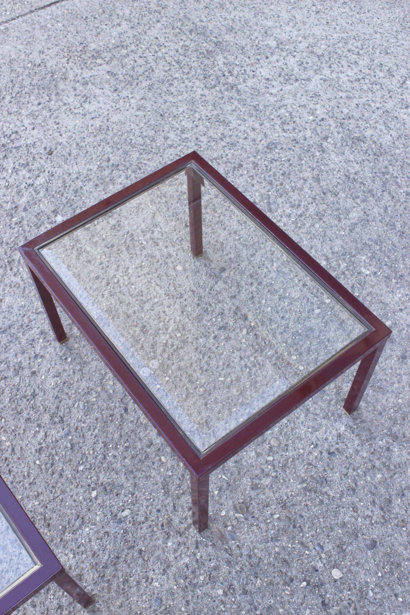Nesting tables in burgundy lacquered metal and brass, France 1950s
