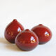 Trio of red miniature ceramics by Antonio Lampecco