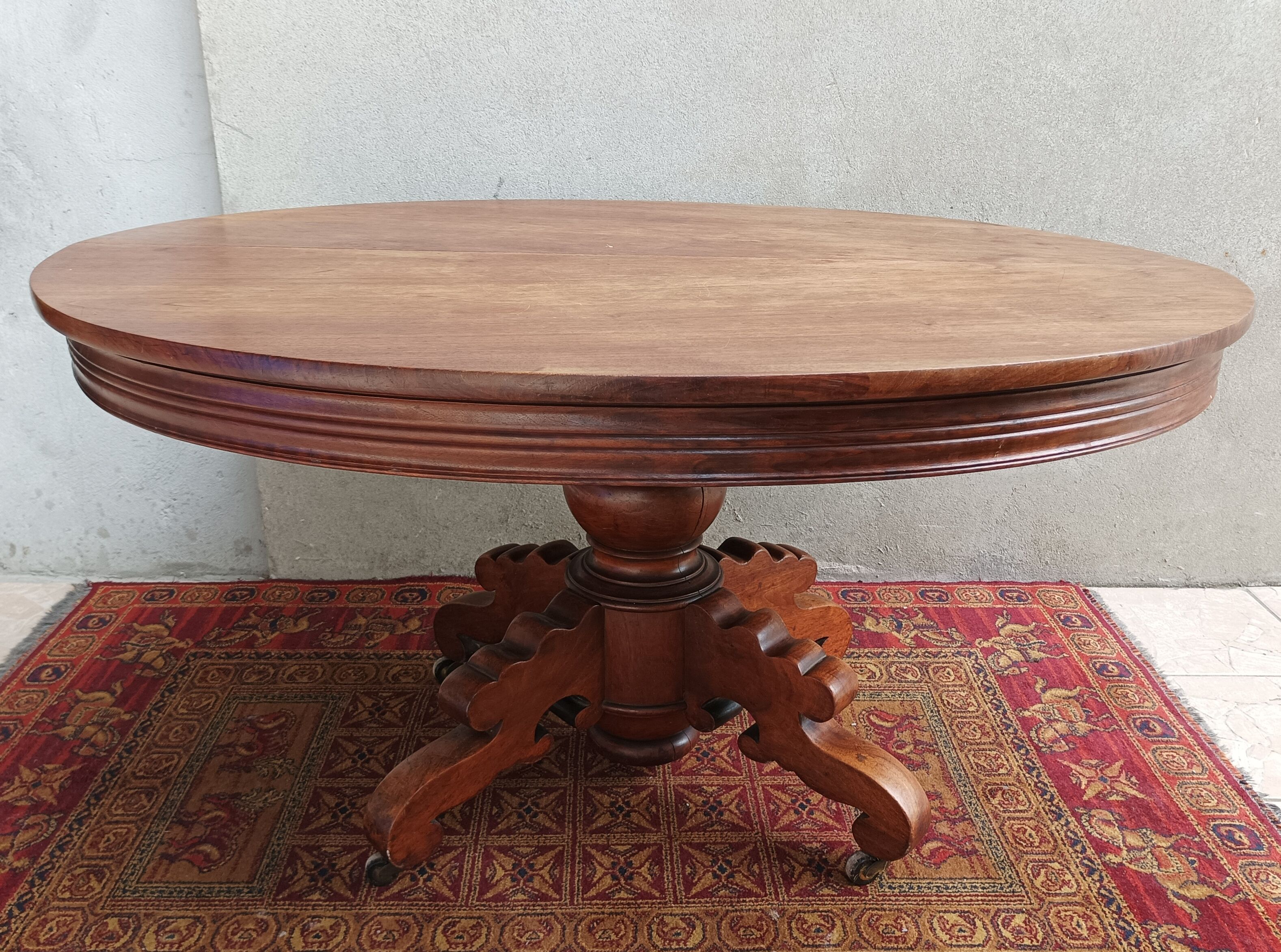English oval table with 19th century mahogany extensions