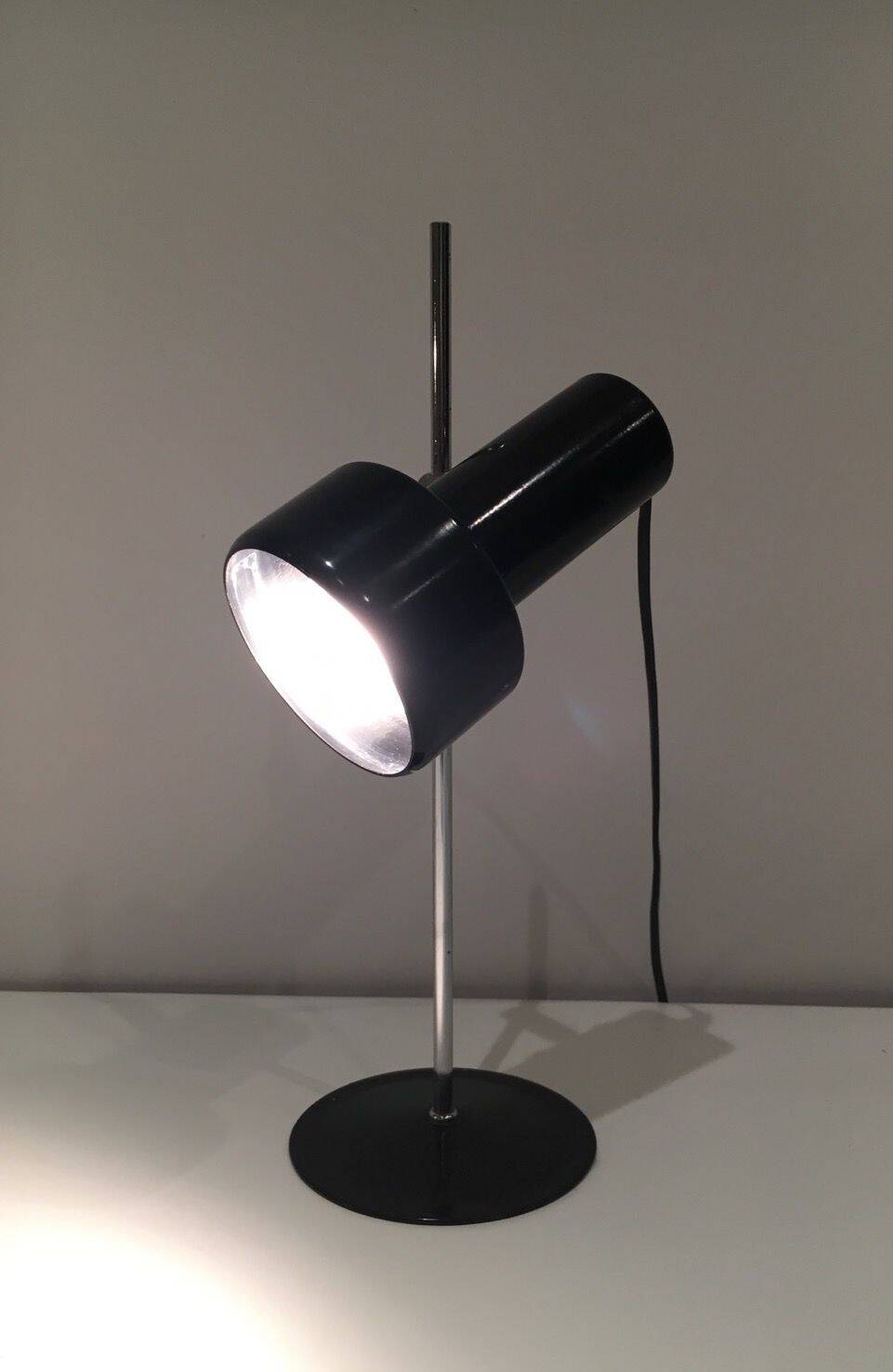 Adjustable lamp in black lacquered metal and chrome. French work. Circa 1970.