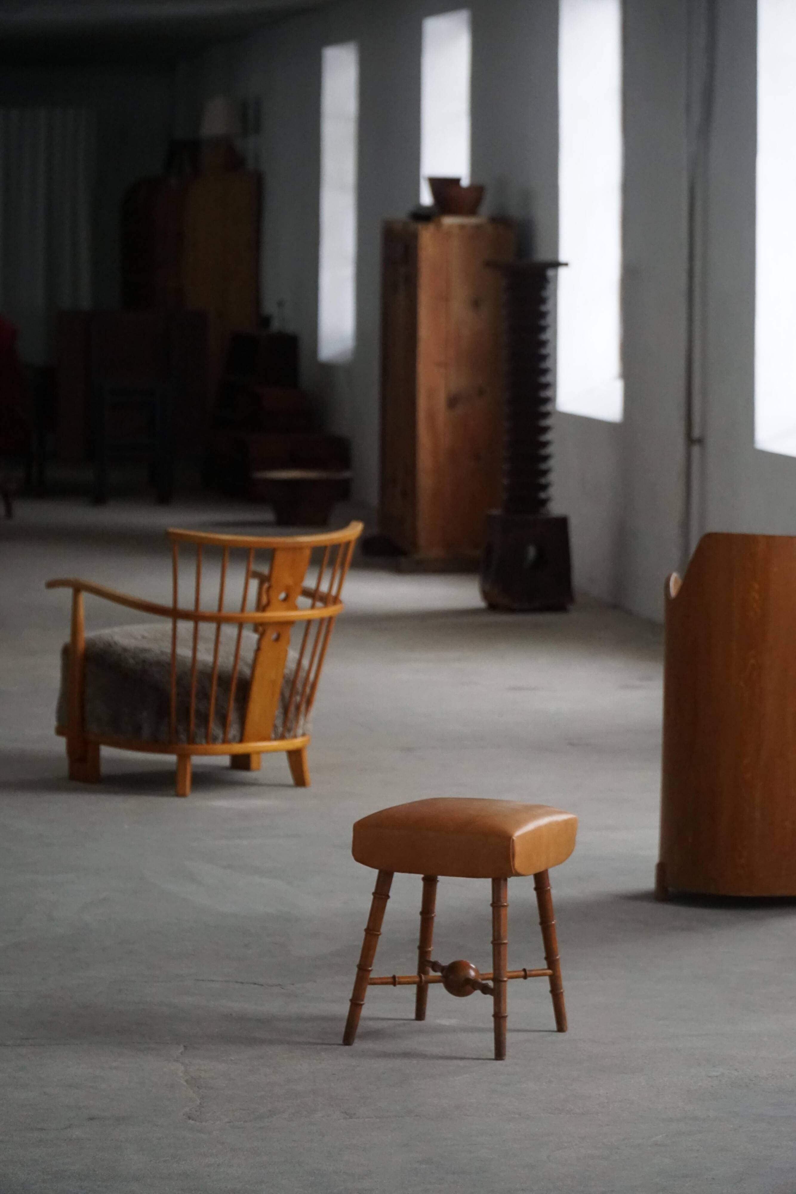 Turned wooden stool with leather seat, mid-20th century, Danish modern.