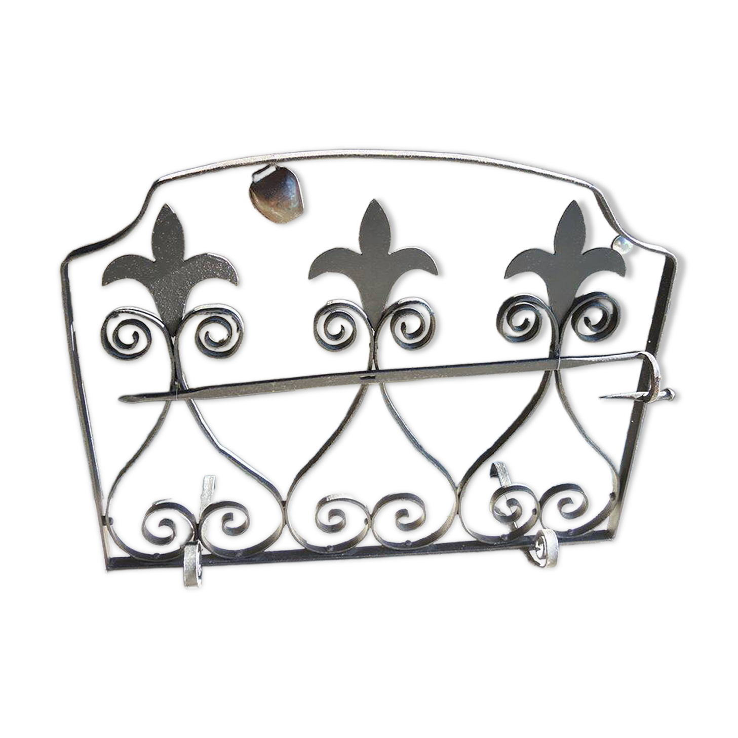 Old wrought iron fleur-de-lis fire screen
