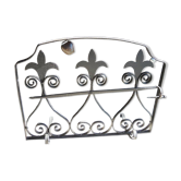 Old wrought iron fleur-de-lis fire screen