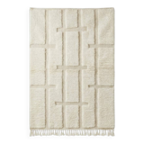 Berber rug with a white graphic pattern.