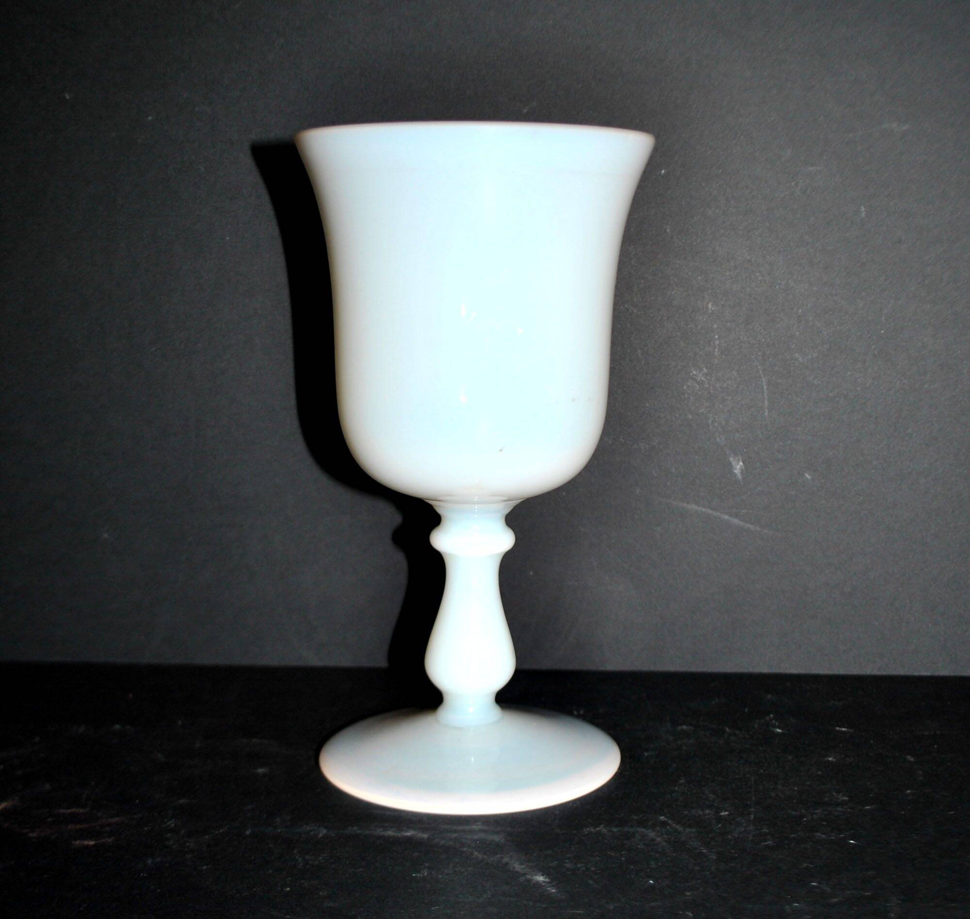 Ancient opaline white glass goblet with a soap bubble effect.