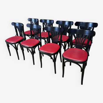 Ensemble de 8 chaises bistrot a palmettes noires et skaï rouge France