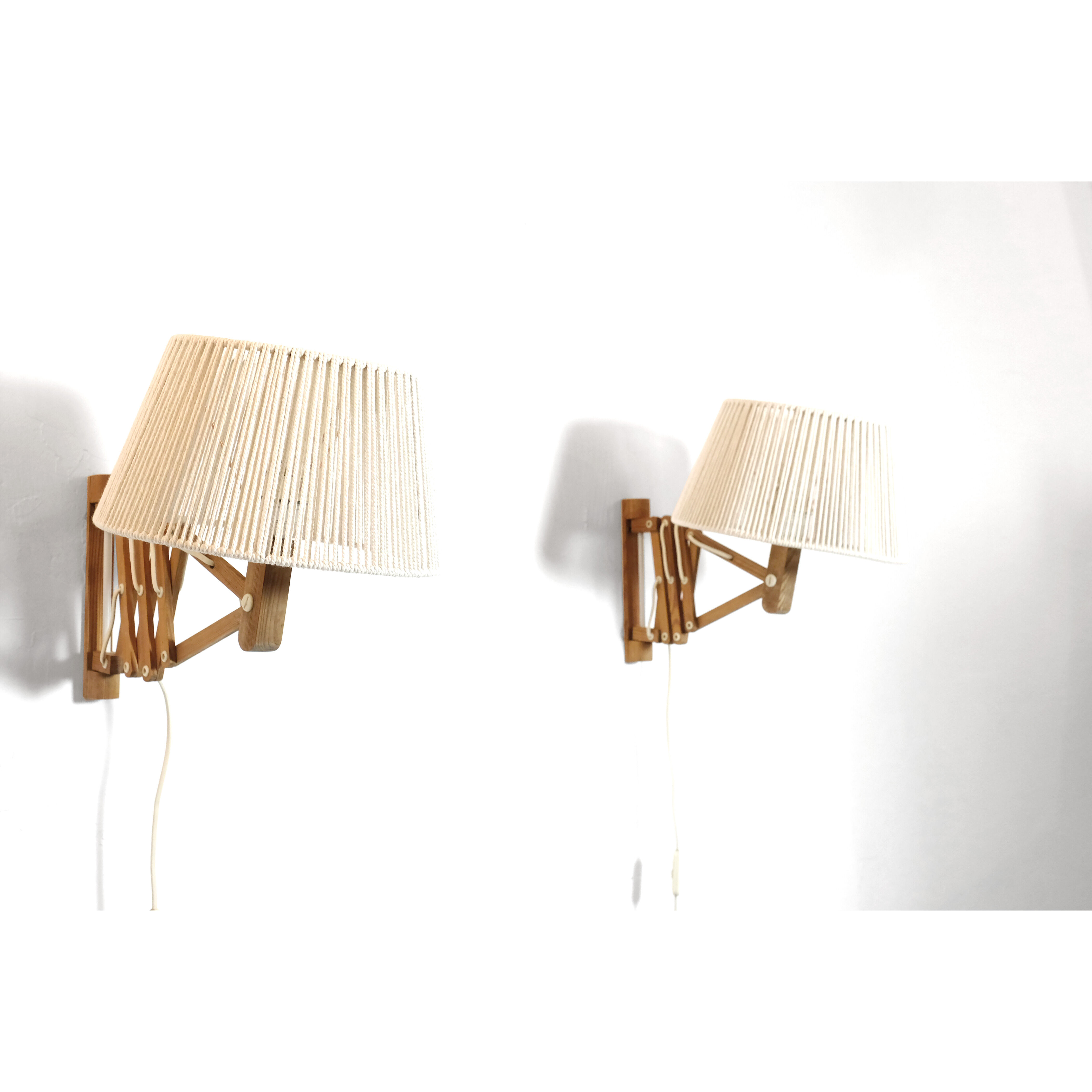 Pair of pine accordion sconces with cotton rope lampshade.
