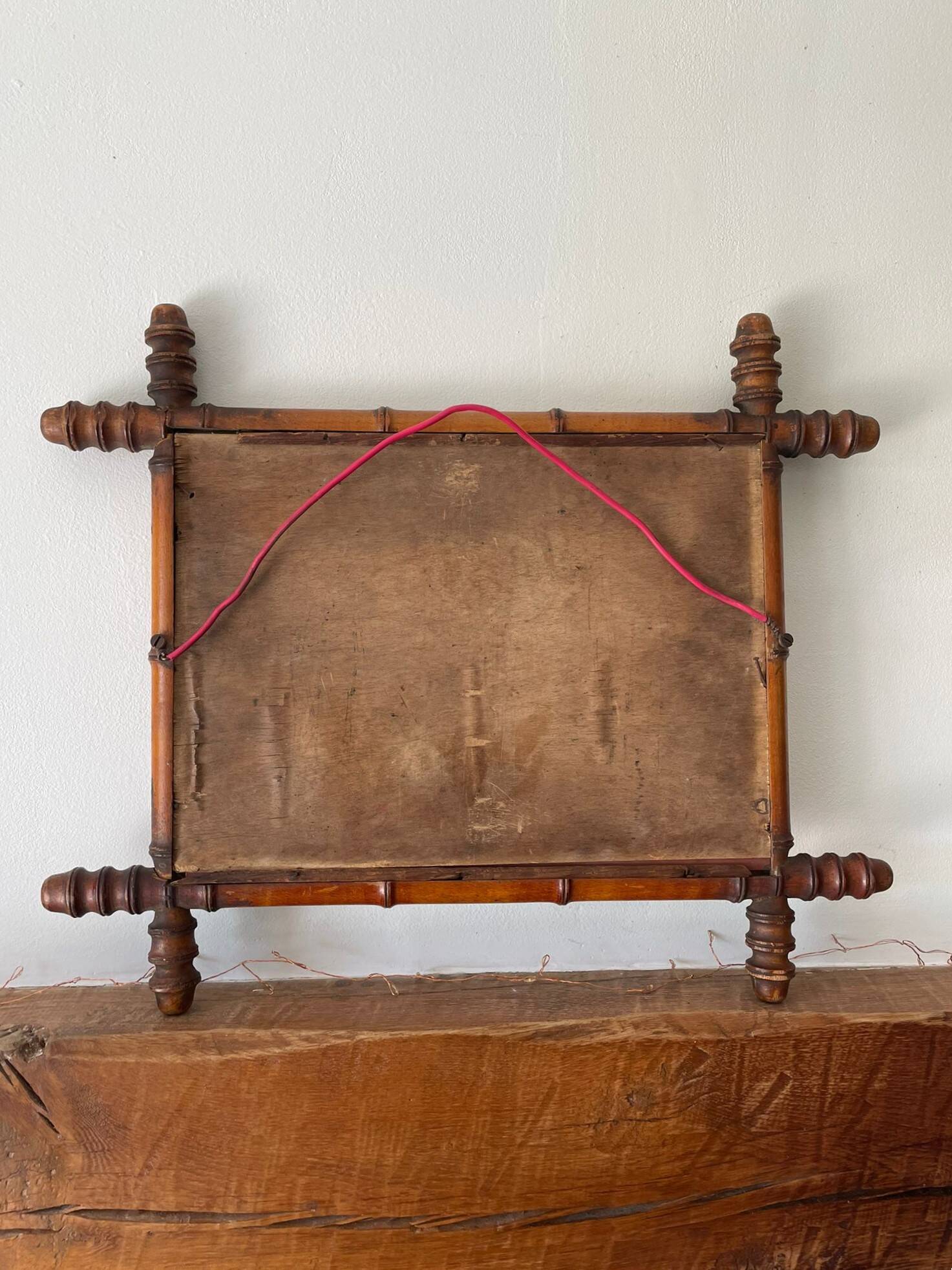 Vintage wooden mirror imitating bamboo
