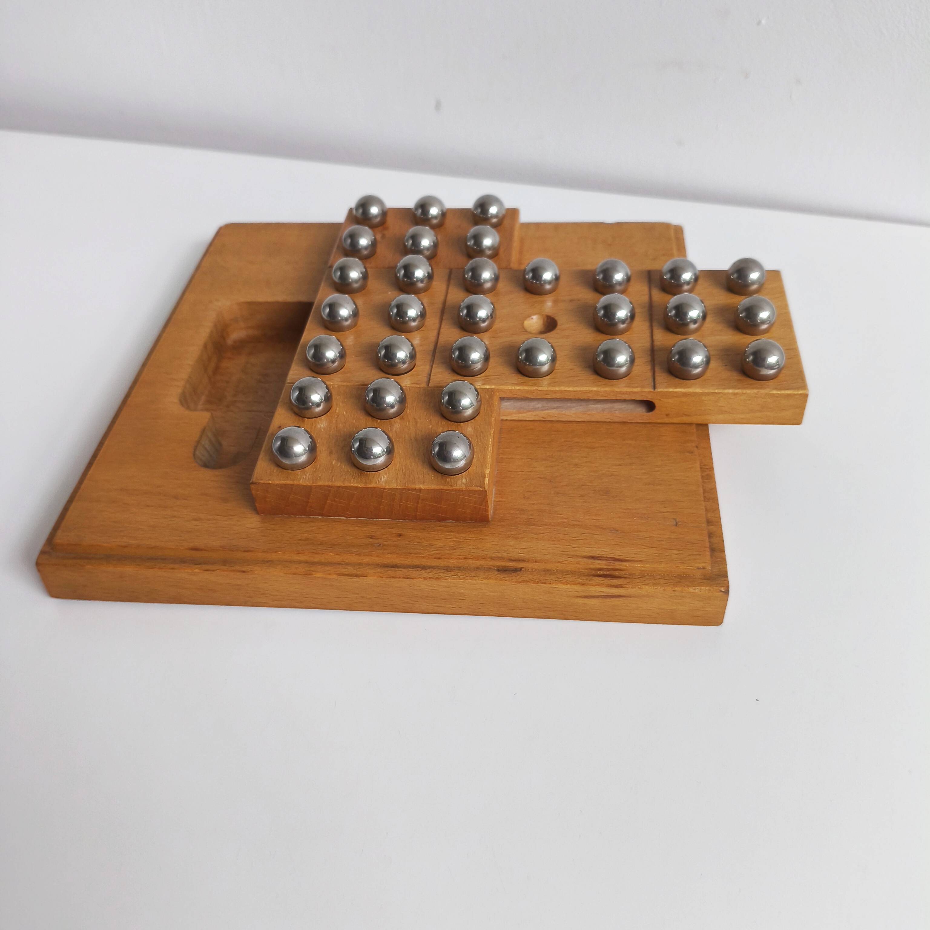 Solid wood and chrome steel solitaire game