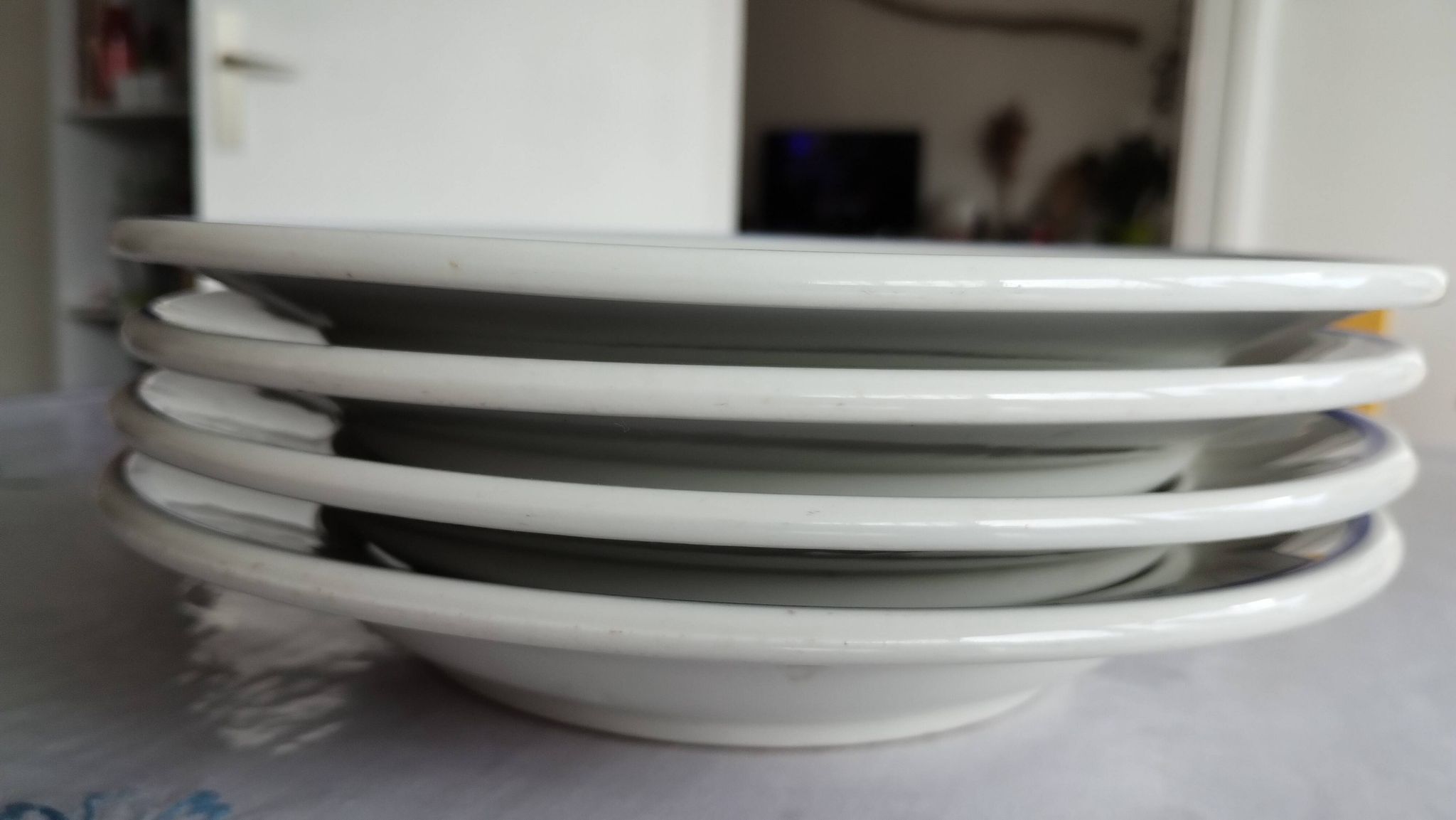3 Pillivuyt white porcelain dinner plates with blue edging.