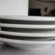 3 Pillivuyt white porcelain dinner plates with blue edging.