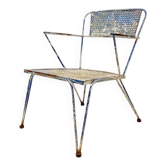 Vintage perforated metal armchair from the 1950s.