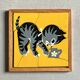 Wooden frame puzzle from the 1940s/50s depicting a cat on a yellow background.