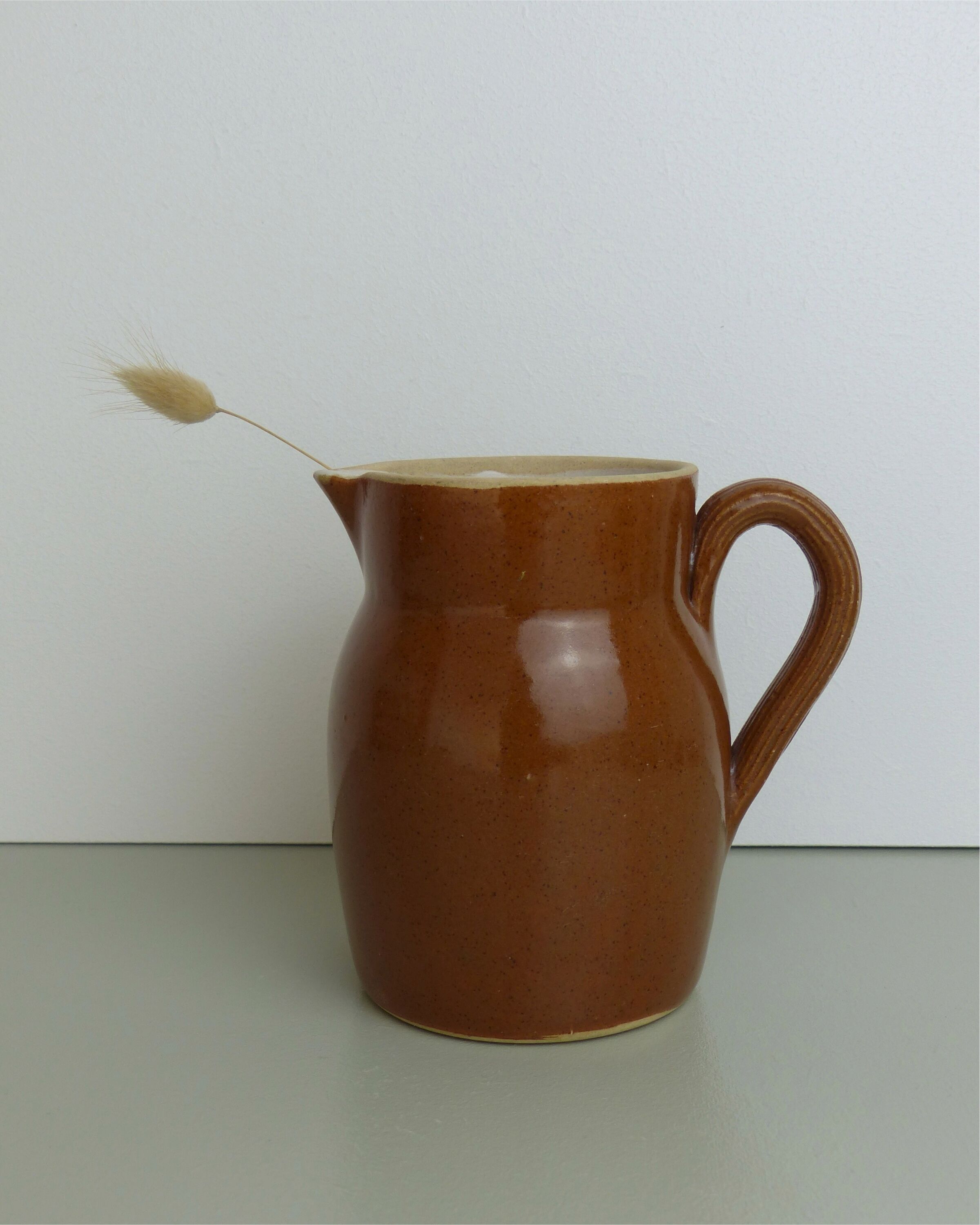Pitcher or milk pot in speckled enamelled sandstone