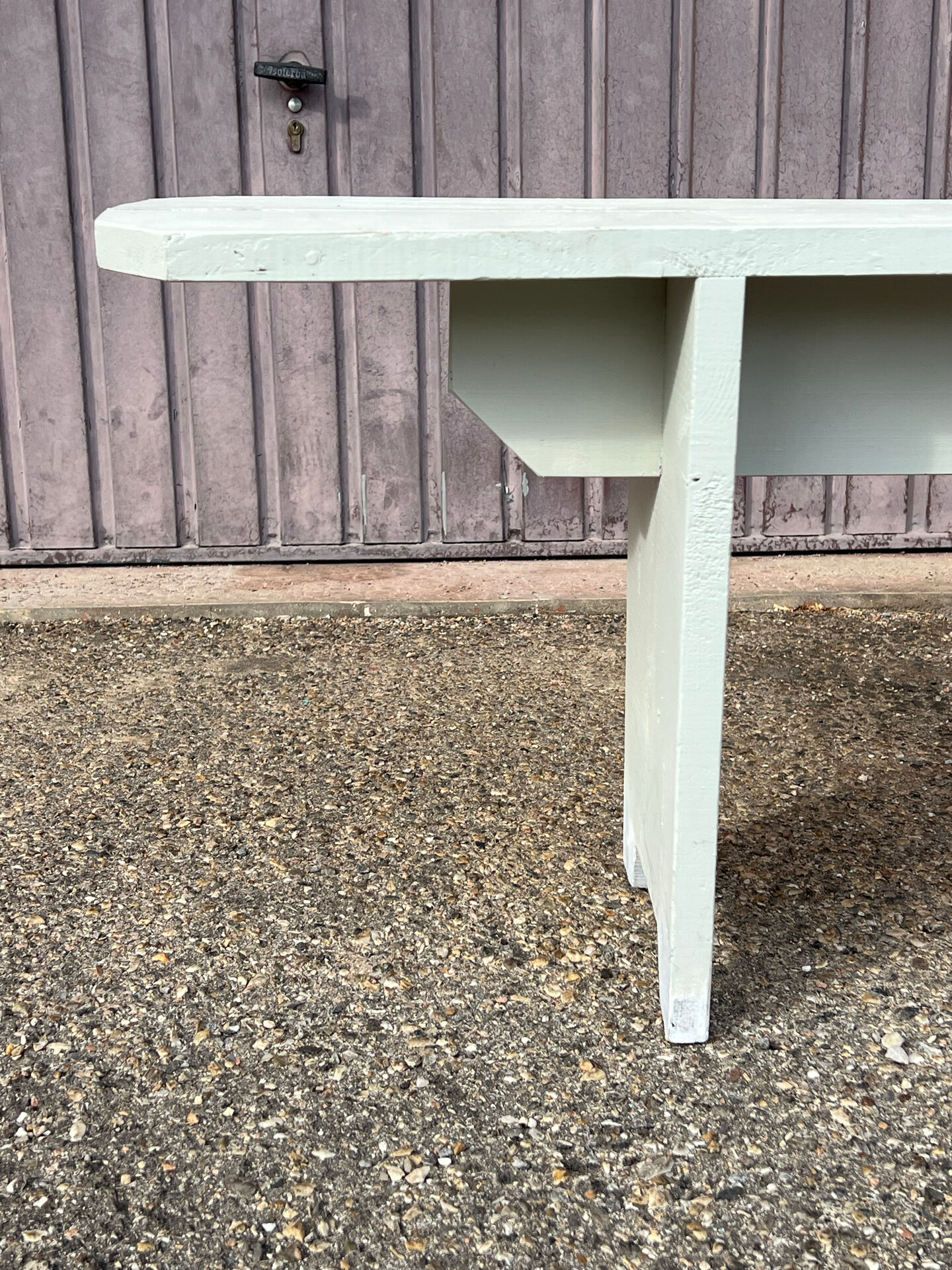 Pair of wooden benches painted white, French artisanal work.