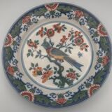Wall plate in earthenware decorated with painting of flowers and bird 28 cm