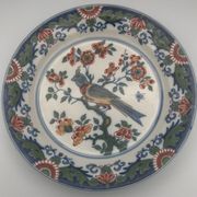 Assiette murale en faïence à décor de peinture de fleurs et oiseau 28 cm