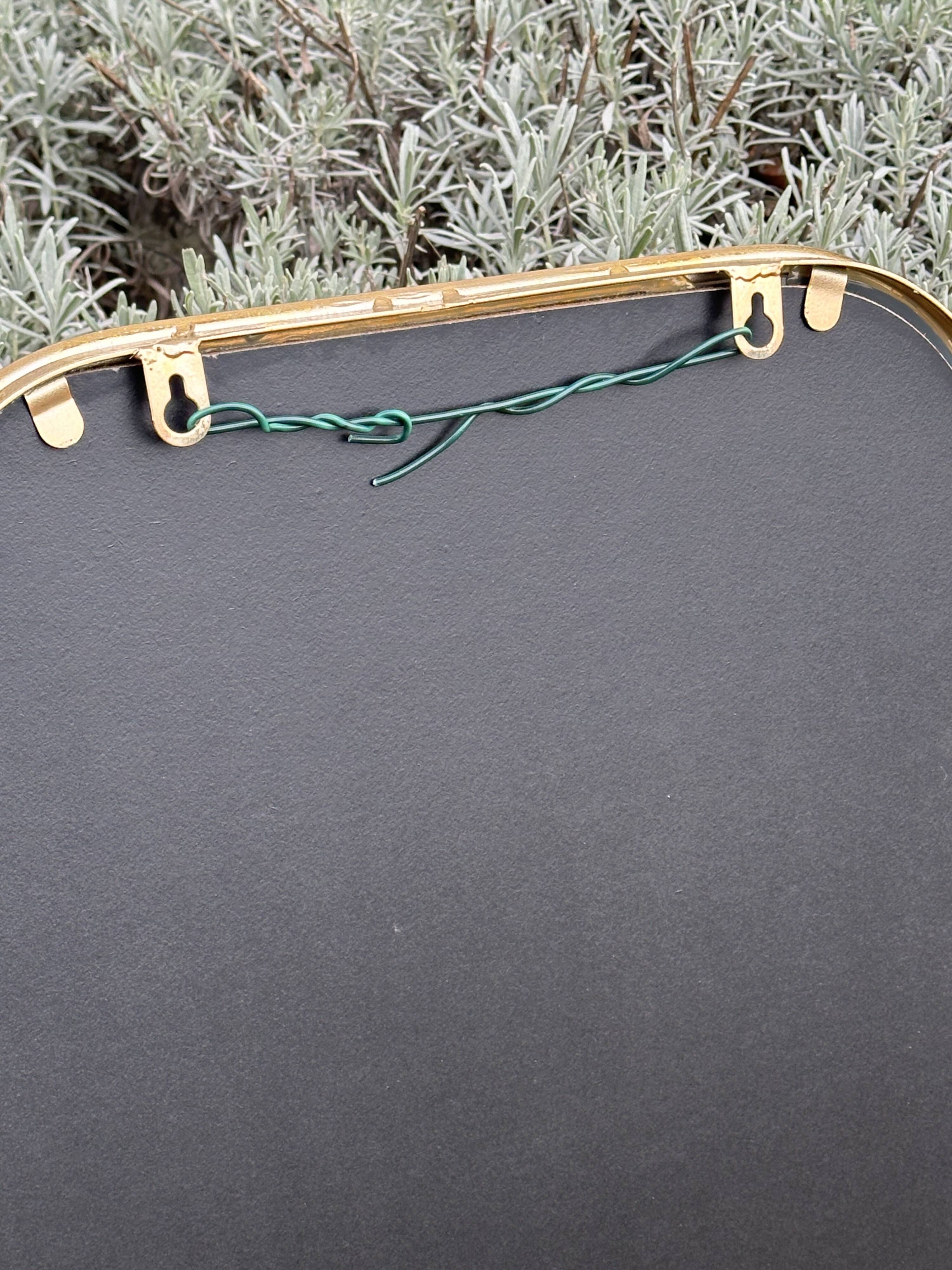 Art Deco style mirror in patinated gold iron 85 x 60 cm