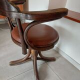 Thonet armchair, swivel, in wood and faux leather.