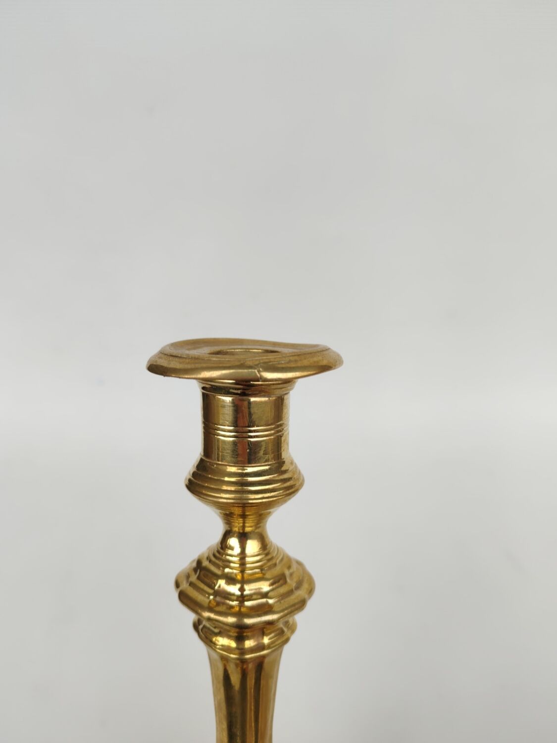 Pair of solid brass candlesticks, early 18th century.